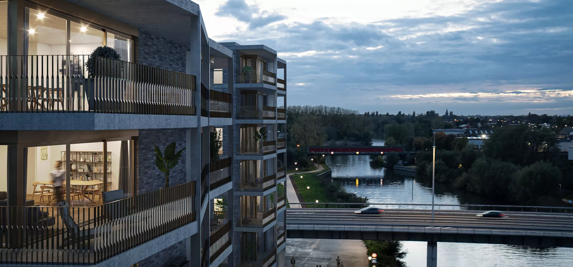 Kaai Living appartementen aan de Leie in Kortrijk bij avondlicht