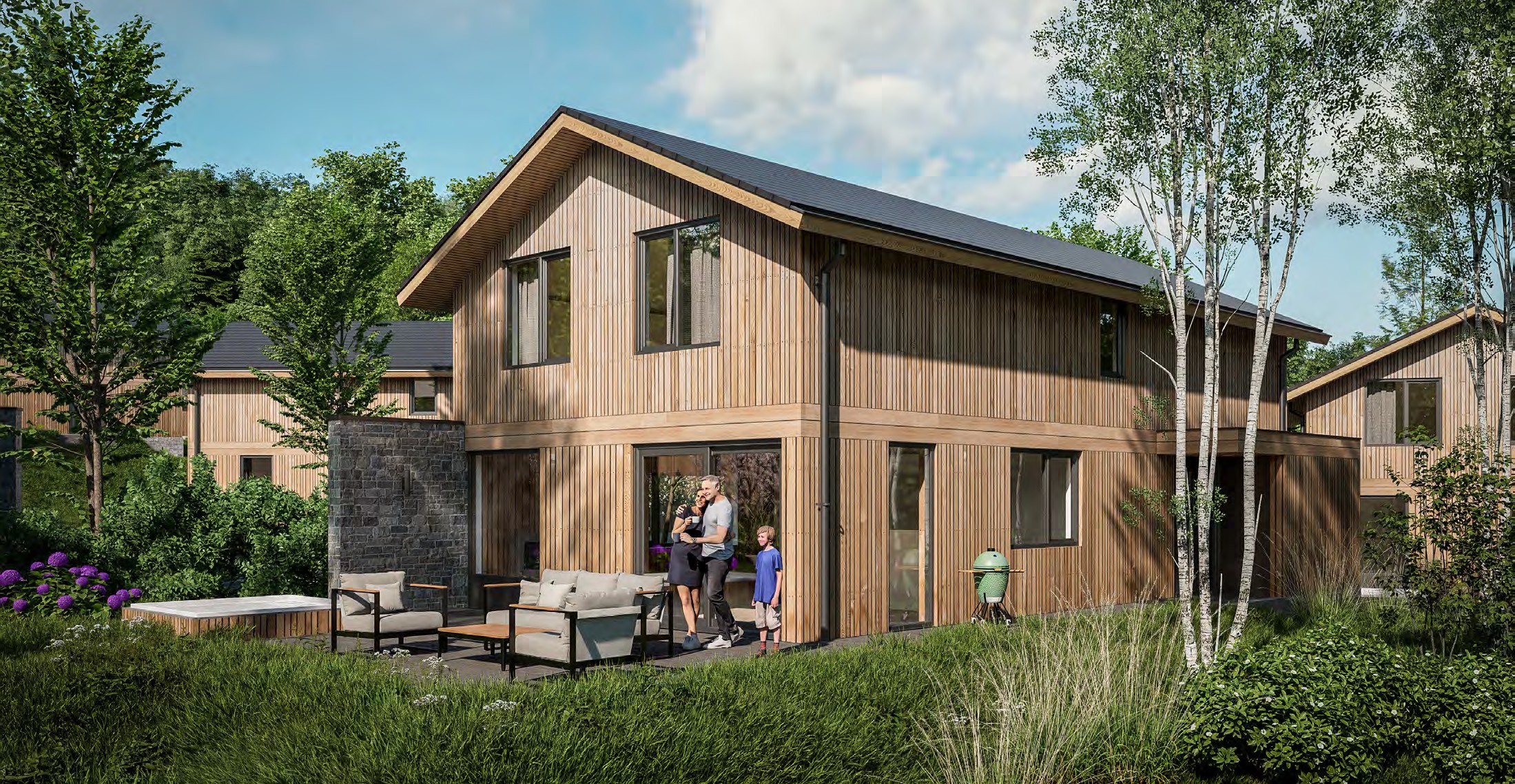Designvilla van UplandParcs Harz in een bosrijke omgeving met familie op het terras