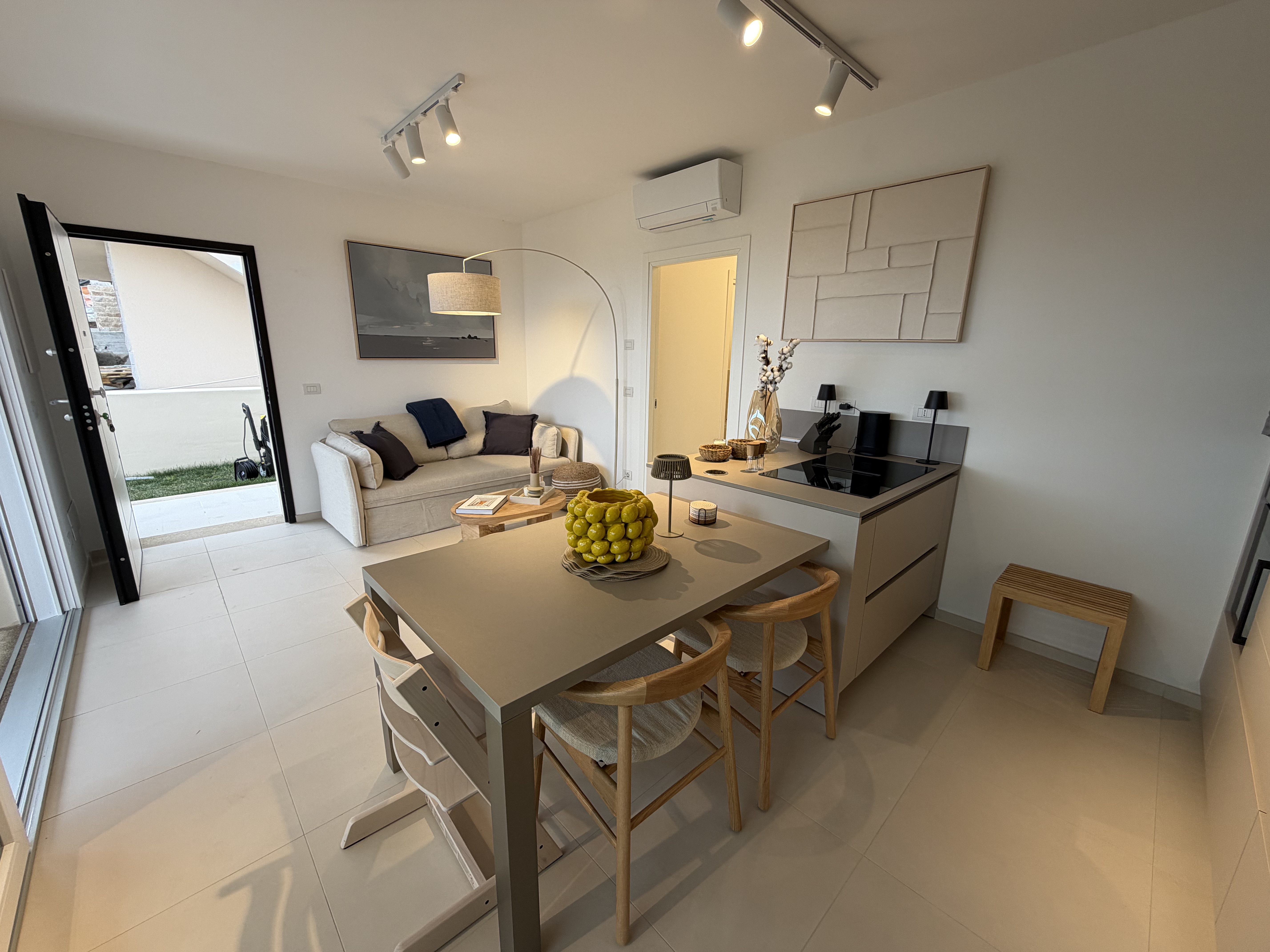 Modern kitchen with dining area and access to the garden