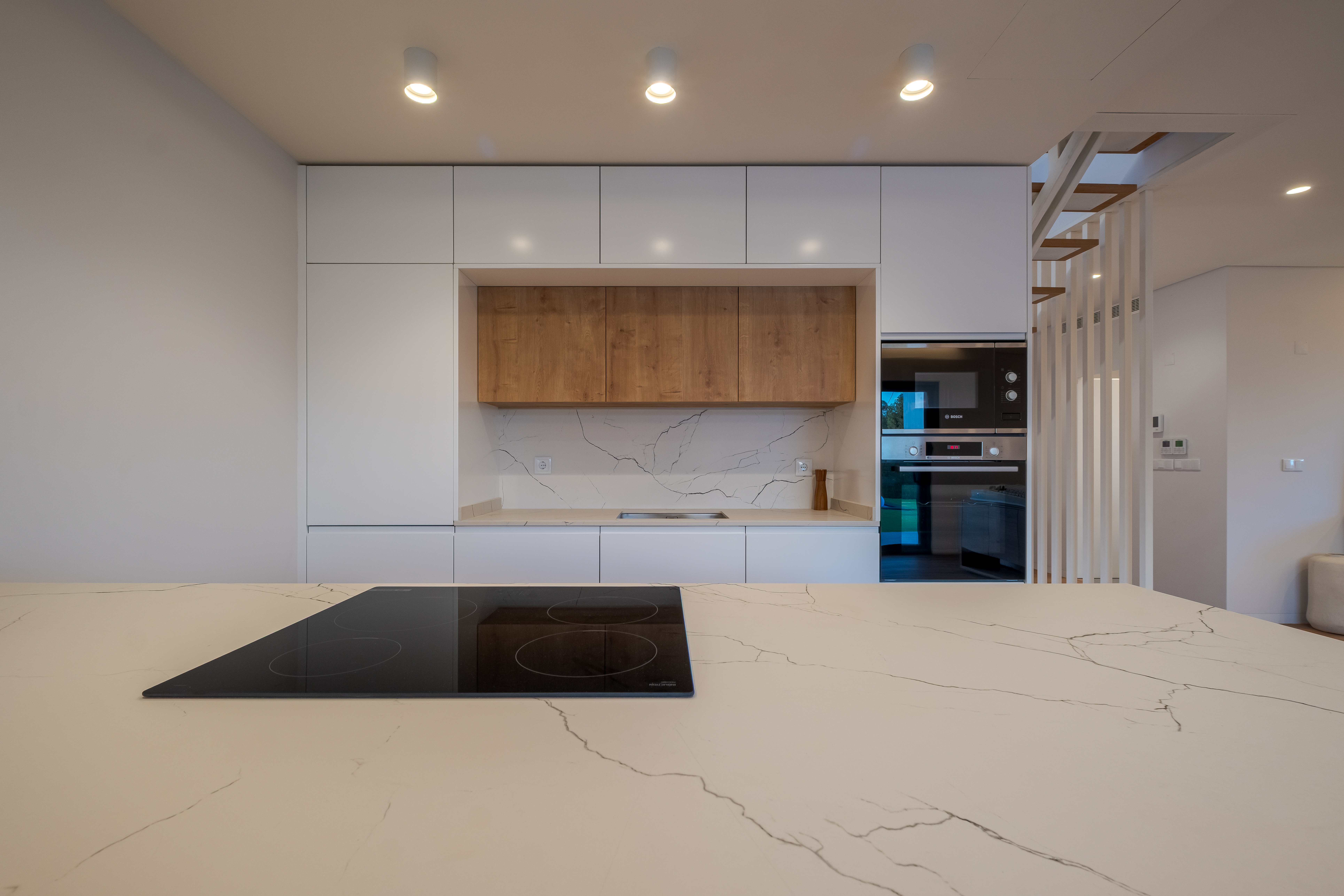 Marble kitchen island with induction cooktop