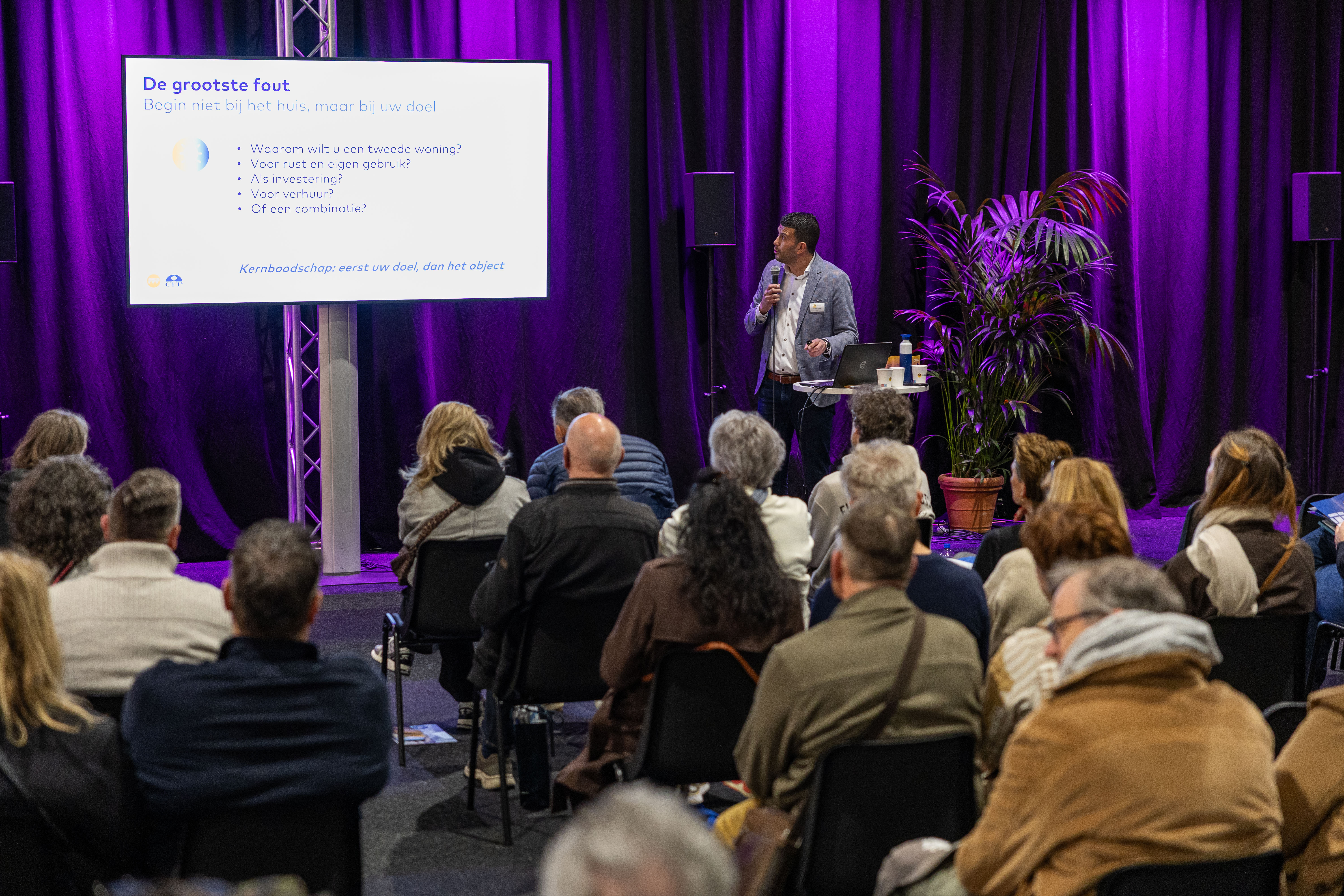 Seminar met spreker en publiek op de beursvloer