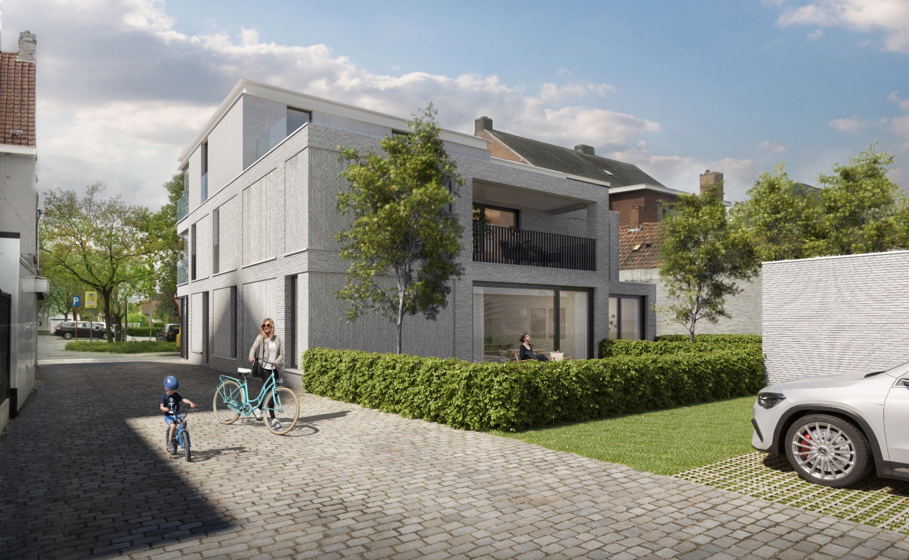Achterzijde van De Mote met terras en groene omgeving