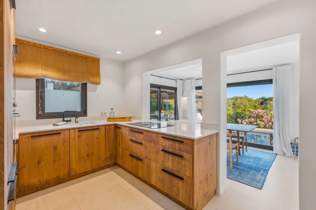 Kitchen of Villa Seven in warm wood and white