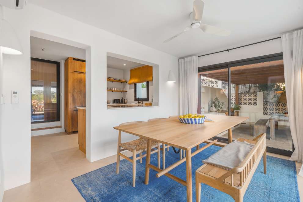 Dining area of Villa Seven with open connection to the terrace