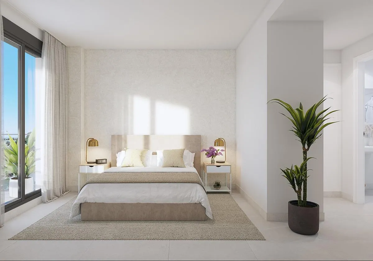 Master bedroom met balkon in een Abril-appartement