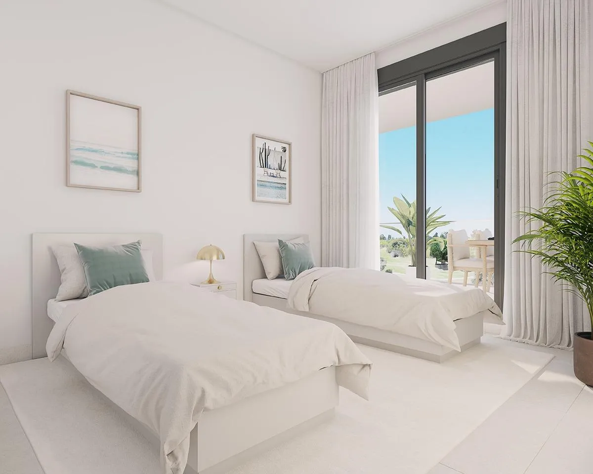 Slaapkamer met twee bedden in een Abril-appartement