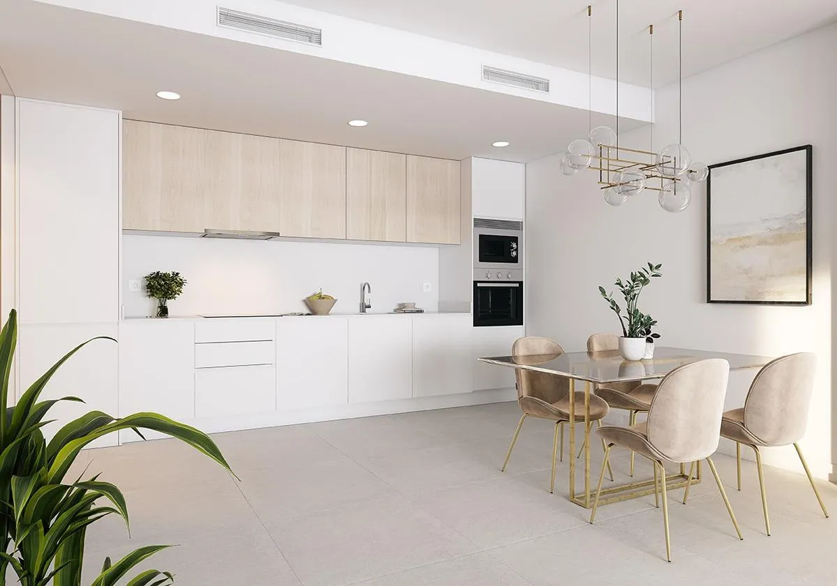 Open keuken met houten accenten in een Abril-appartement