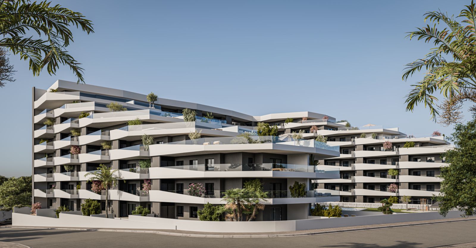 Het gebouw met zijn golfvormige terrassen en groene planten