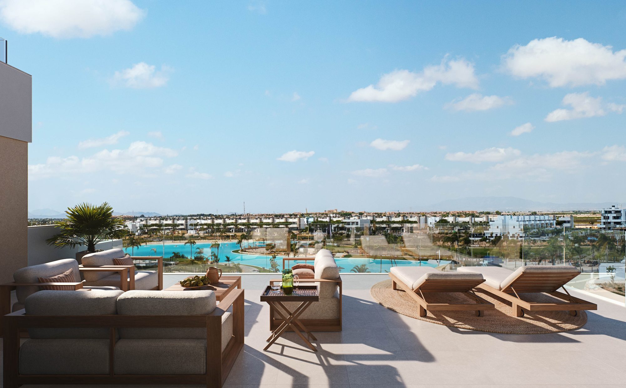 Covered terrace with lounge area and view of the resort