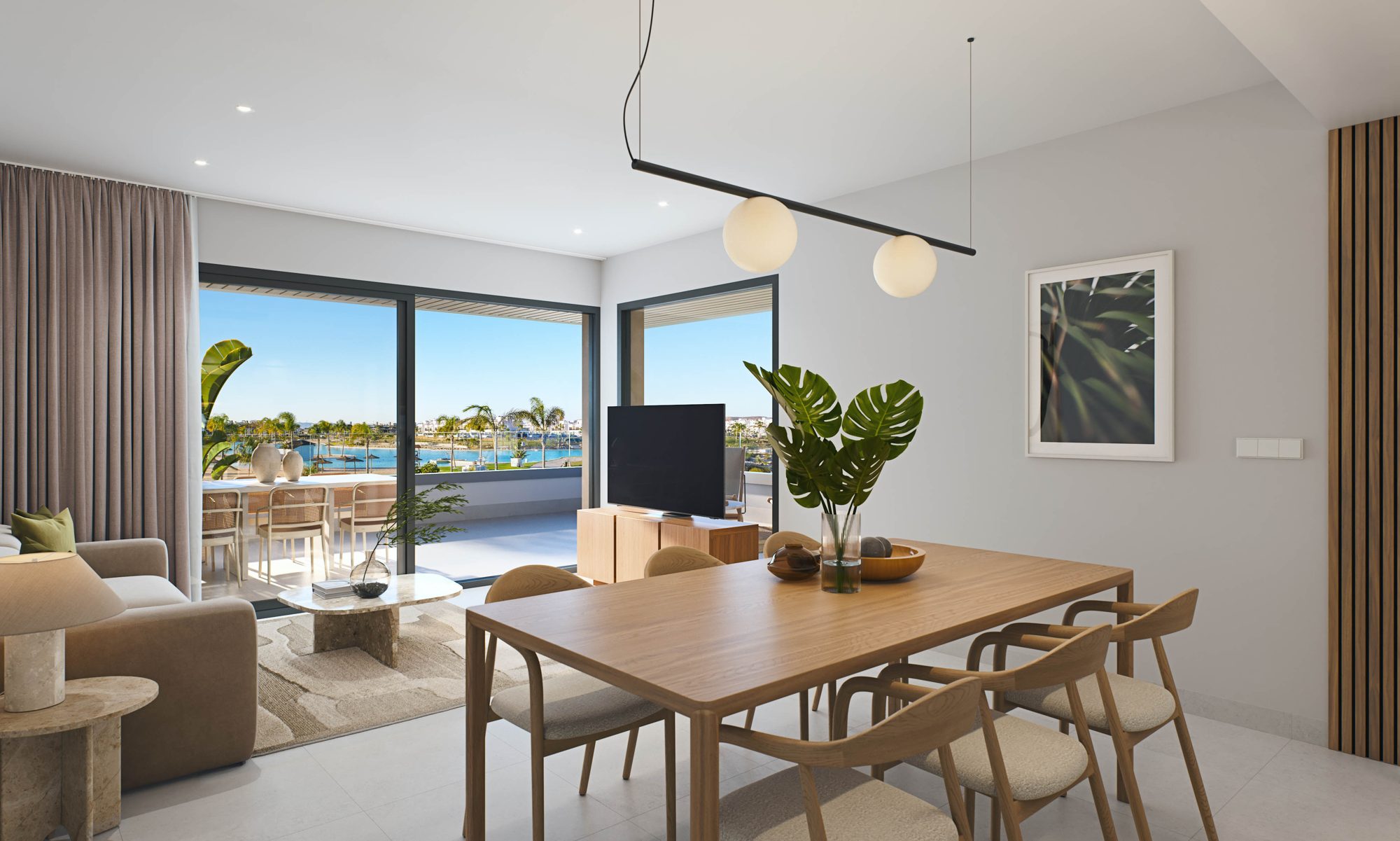 Open living and dining area with kitchen and terrace doors