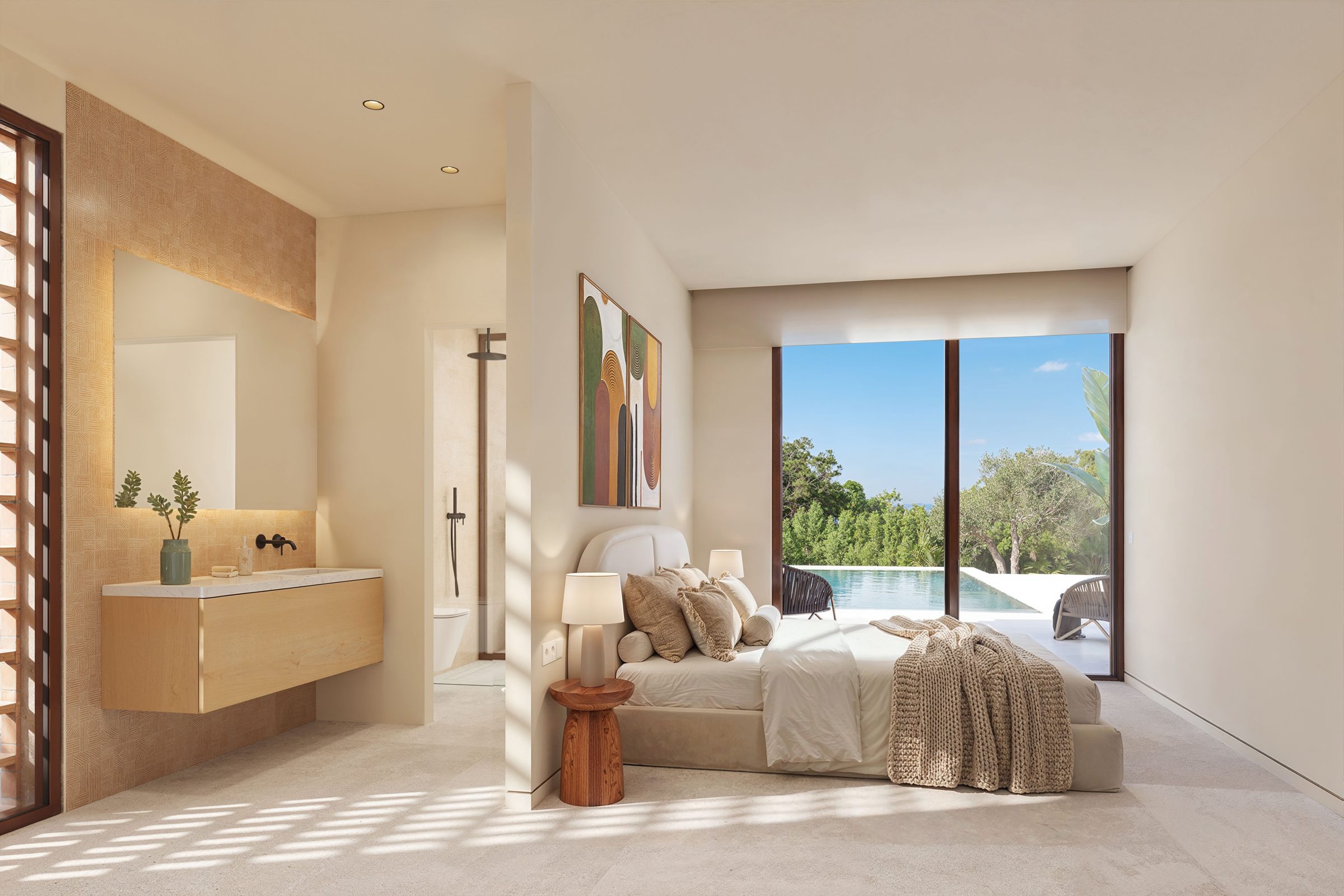 Master bedroom with bathroom and views of the swimming pool