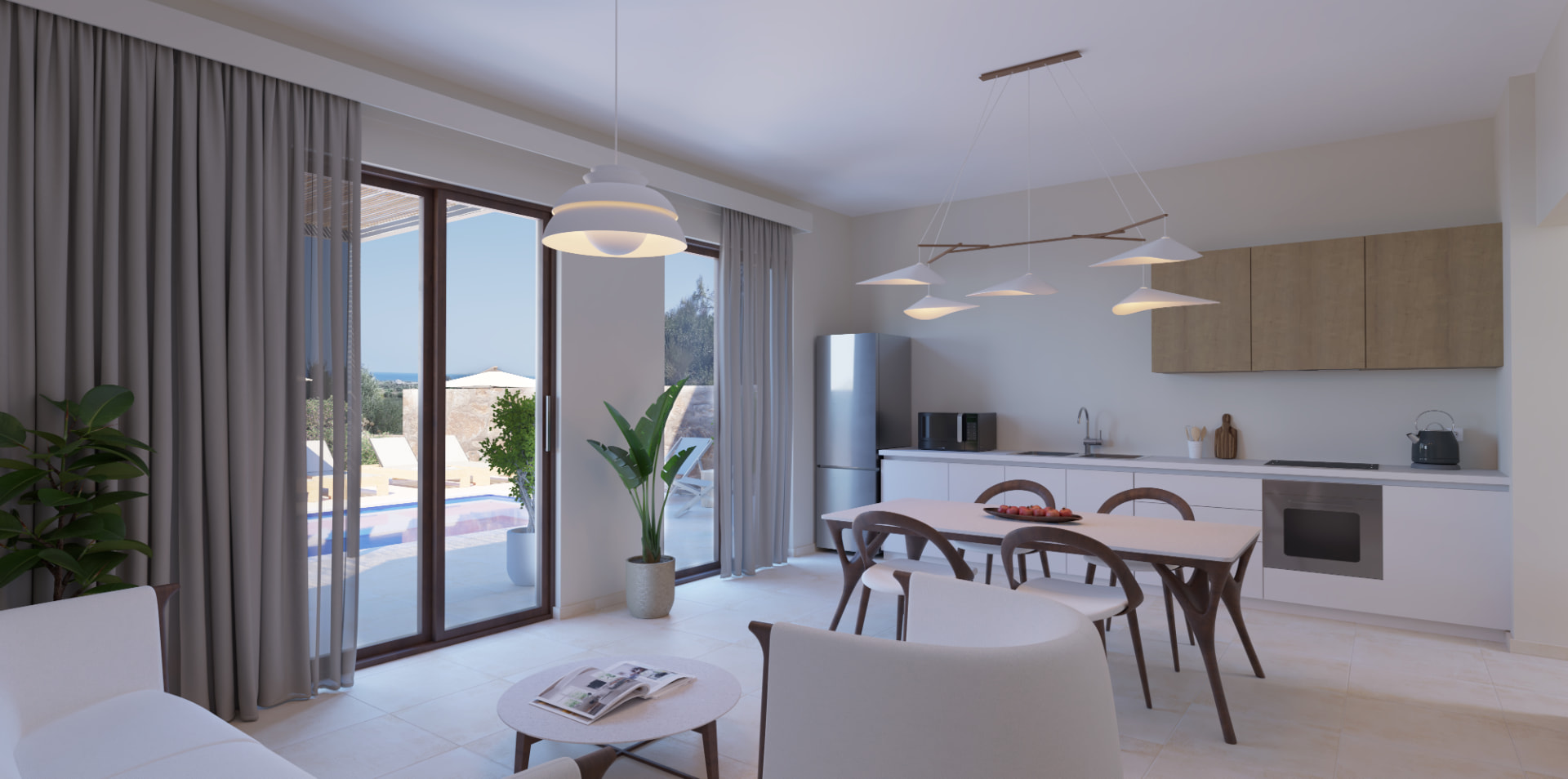 Das Wohnzimmer einer Sunset Villa mit offener K&uuml;che und Blick auf den Pool