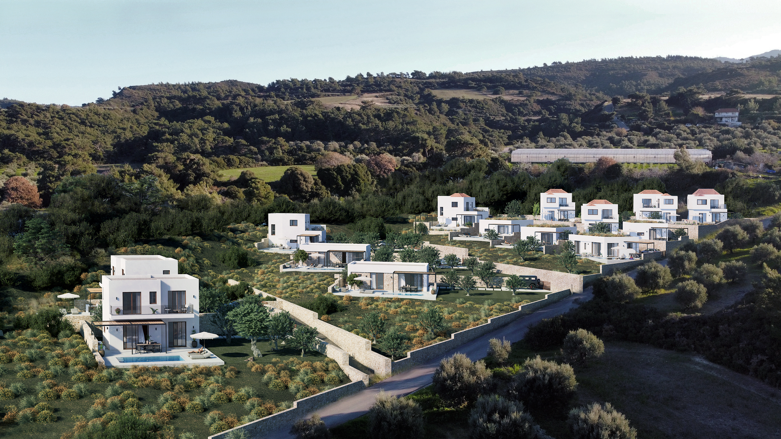 Die Villen der Sunset Villas Rhodes inmitten gr&uuml;ner H&uuml;gel