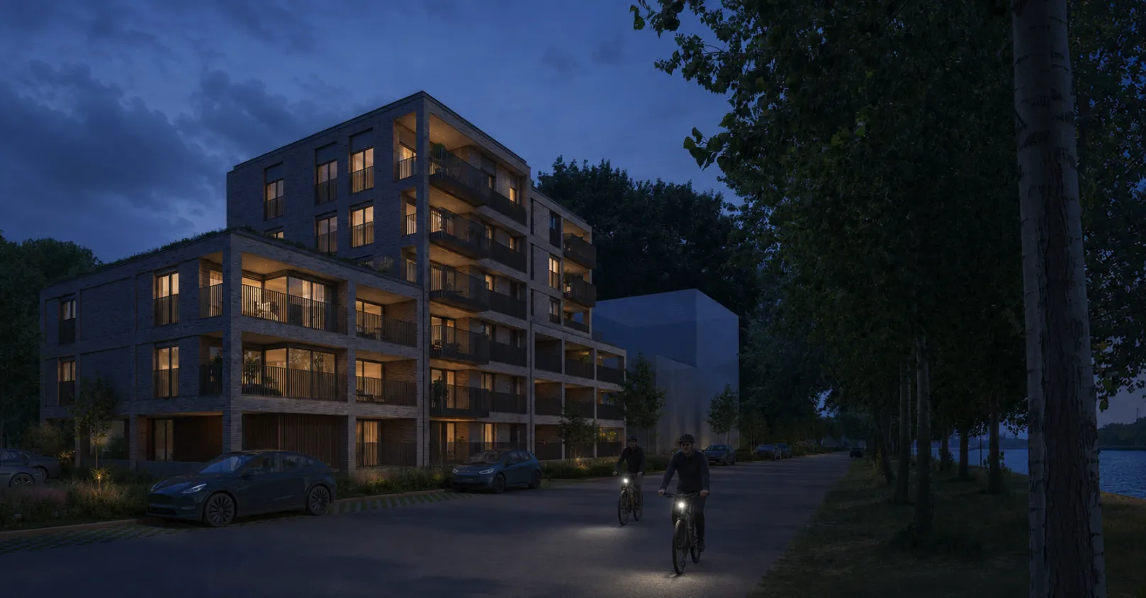 Avondzicht op Residentie Waterkant langs het kanaal
