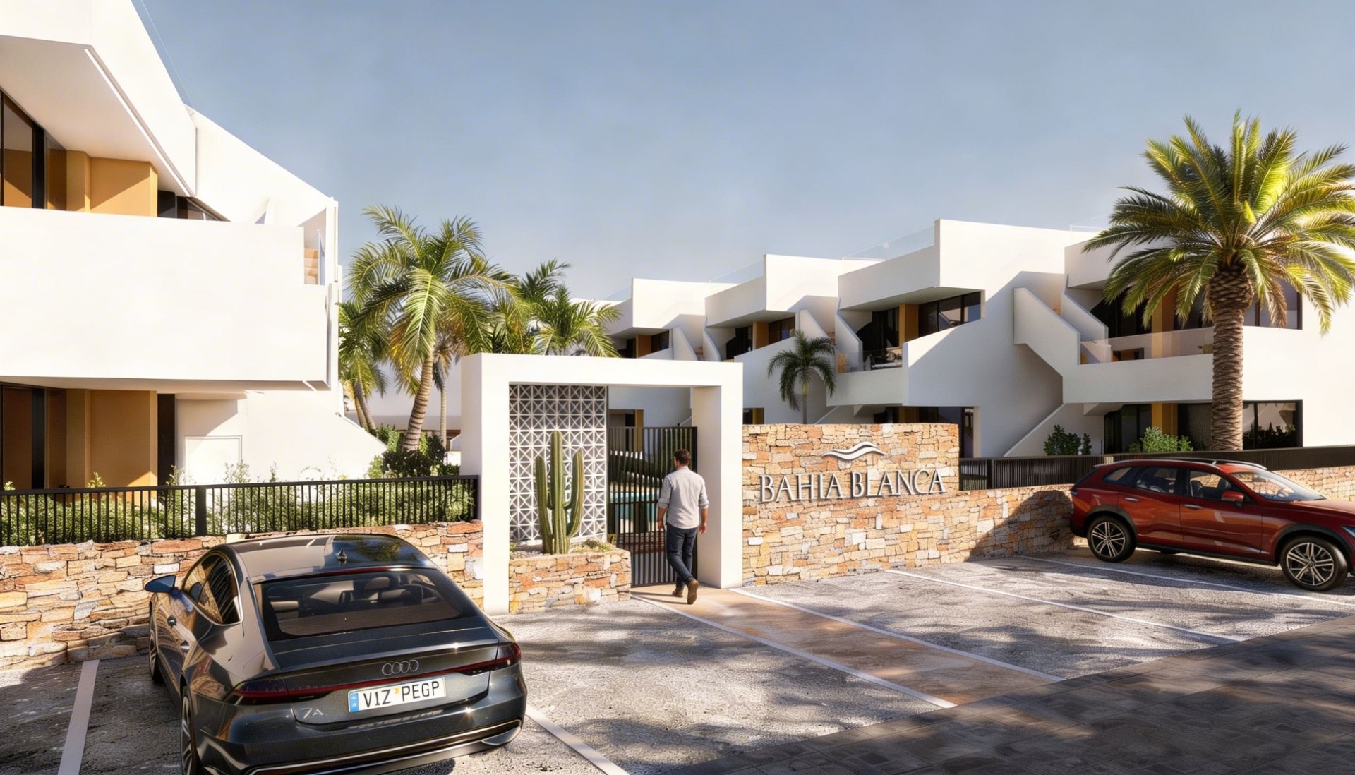 Entrance of Bahía Blanca residence with natural stone wall and logo